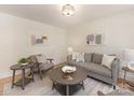 Bright living room with stylish furnishings and neutral color palette at 1422 Burnley Rd, Charlotte, NC 28210