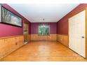 Cozy dining room with hardwood floors, wainscoting, and natural light at 154 Seven Oaks Ln, Statesville, NC 28677