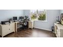 Cozy office space with a large window, wood floors, and neutral paint at 16038 Harbor Hill Dr, Charlotte, NC 28273