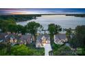 Gorgeous aerial view of the home with waterfront access and lush landscaping at 17819 John Connor Rd, Cornelius, NC 28031