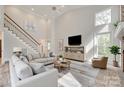 Bright living room with tall ceilings, hardwood floors, staircase, and comfortable seating at 2345 Sparrow Dr, Rock Hill, SC 29732