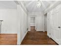 Bright hallway featuring hardwood floors, fresh white paint and views into another room at 2410 Armstrong Park Dr, Gastonia, NC 28054