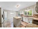Bright kitchen featuring granite counters, tile backsplash, stainless appliances, and center island at 2410 Armstrong Park Dr, Gastonia, NC 28054
