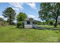 Beautiful one-story home with a lush yard and mature trees at 3050 Millstone Dr, Gastonia, NC 28054