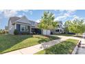 Charming gray home featuring a manicured lawn, mature landscaping and a two-car garage at 3267 Lock Erne Ave, Kannapolis, NC 28081