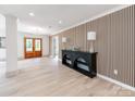 Inviting entryway featuring a decorative console table and stylish wood accent wall at 3501 Providence Rd, Charlotte, NC 28211