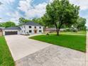 Expansive front yard with a long drive leading to a modern two-story white brick home at 3501 Providence Rd, Charlotte, NC 28211