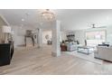 Spacious and inviting living room with a decorative chandelier, offering open layout and natural light at 3501 Providence Rd, Charlotte, NC 28211