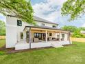 Wonderful covered brick patio with ample seating, perfect for outdoor relaxation and entertaining at 3501 Providence Rd, Charlotte, NC 28211