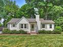 Charming exterior view of a well-manicured home with lush green lawn and landscaping at 4921 Doris Ave, Charlotte, NC 28205