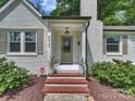 Inviting front entrance with a brick walkway and well-maintained landscaping at 4921 Doris Ave, Charlotte, NC 28205
