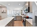Modern kitchen with stainless steel appliances, white subway tile, and stone countertops at 518 Lockwood Creek Dr # 32, Charlotte, NC 28208