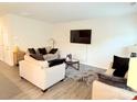 Bright living room with neutral tones and cozy seating area, perfect for relaxing and entertaining at 9340 Grand Valley Dr, Charlotte, NC 28213