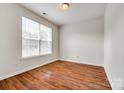 Bright bedroom featuring hardwood floors and large window for natural light at 975 Copperstone Ln, Fort Mill, SC 29708