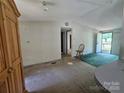 Living room with carpet, light fixtures, and natural light at 1001 Bexley Ln, Lincolnton, NC 28092
