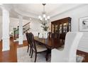 Elegant dining room featuring classic furnishings, decorative molding, and a sophisticated chandelier at 10205 Alouette Dr, Waxhaw, NC 28173