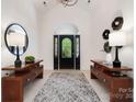 Bright entryway boasting tiled floors, high ceilings, stylish decor, and a front door with decorative glass at 1245 Bellemeade Ln, Charlotte, NC 28270