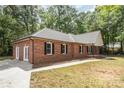 A beautiful brick house with a mix of classic and modern design, complemented by a well-kept lawn at 1513 White Ridge Dr, Rock Hill, SC 29732