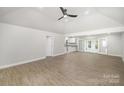 Bright and spacious living room with modern flooring, high ceiling, and neutral paint, leading to outdoor access at 1513 White Ridge Dr, Rock Hill, SC 29732