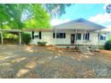 Charming single story home with a covered front porch and an attached carport at 16603 Nc Hwy 73 Hwy, Albemarle, NC 28001