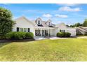 Well-maintained white home with a covered front porch and manicured landscaping at 1728 Privette Rd, Matthews, NC 28105
