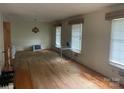 Spacious living room with hardwood floors and large windows offering plenty of natural light at 205 Rudolph Rd, Salisbury, NC 28146