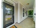 Inviting front porch with sturdy columns and a view of the neighborhood at 2305 Blueberry St, Belmont, NC 28012