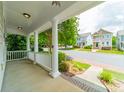 The view from the covered front porch provides an open view of the neighborhood at 2305 Blueberry St, Belmont, NC 28012