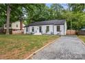 Attractive single-story home with a well-maintained lawn and new gravel driveway at 3538 Denson Pl, Charlotte, NC 28215