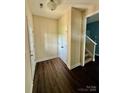 Inviting foyer with hardwood floors, closet, and staircase leading to the upper level at 4048 Avis Way, Monroe, NC 28110
