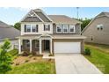 Attractive two-story home with brick accents, a two-car garage, and a well-maintained front lawn at 423 Shallowford Dr, Rock Hill, SC 29732
