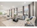 Bright living room with modern furnishings, neutral colors, and ample natural light at 514 Rich St, Rock Hill, SC 29730