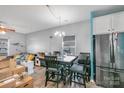 This dining area features a modern table and a stainless-steel refrigerator at 518 Dutch White Dr, Clover, SC 29710