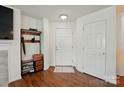 Bright foyer featuring wood flooring, a coat rack, and neutral walls for a clean and inviting space at 529 N Graham St # 3F, Charlotte, NC 28202