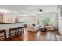 Open-concept living room with lots of natural light, hardwood floors, and neutral decor for relaxation at 529 N Graham St # 3F, Charlotte, NC 28202