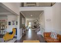 Inviting foyer featuring hardwood floors, neutral walls, and views of the living space at 9586 Kartey Nw Ave, Concord, NC 28027