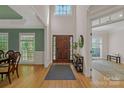 Spacious foyer with hardwood floors and a high ceiling and an inviting entryway at 11224 Warfield Ave, Huntersville, NC 28078