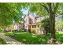 Beautiful two-story brick home featuring a lush front lawn and a welcoming facade at 11224 Warfield Ave, Huntersville, NC 28078