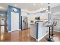Modern kitchen with stainless steel appliances, granite countertops, and bar stool seating at 1221 Brookcrest Ln, Fort Mill, SC 29708