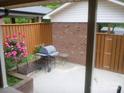 Private patio area with a grill and seating, perfect for outdoor dining and entertaining at 214 Idlewood Dr, Kannapolis, NC 28083