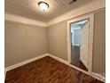 Bedroom features light-colored walls and hardwood floors at 2434 Columbus Cir, Charlotte, NC 28208