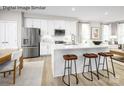 Modern kitchen with stainless steel appliances, white cabinets, and a large center island at 2520 Ellen Ave # 1001C, Charlotte, NC 28208