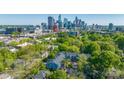 An aerial view showcasing Charlotte's skyline and the surrounding residential community at 300 E Park Ave # 16, Charlotte, NC 28203