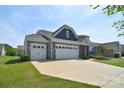 Charming home with well-manicured lawn, stone accents and a three car garage at 3073 Oliver Stanley Trl, Lancaster, SC 29720