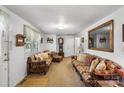 Cozy living room with carpet, two sofas, an ornate mirror and a view into another room at 370 Shiloh Rd, Statesville, NC 28677
