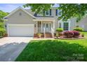 Charming home with well maintained lawn and attractive landscaping with brick accents at 374 Queens Sw Dr, Concord, NC 28025