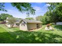Exterior of a versatile outbuilding, with ample space for storage or hobbies, set in a landscaped backyard at 374 Queens Sw Dr, Concord, NC 28025