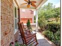 Inviting front porch with rocking chairs and a view of the landscaped yard at 5321 Kathryn Blair Ln, Charlotte, NC 28226
