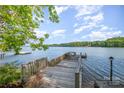 Wooden dock providing scenic views of the expansive lake and a peaceful retreat on the water at 565 Shore Acres Rd, Salisbury, NC 28146