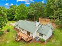 Enjoy this well-maintained home with a spacious wooden deck overlooking a lush backyard and tree coverage at 5903 Wm Griffin Rd, Monroe, NC 28112